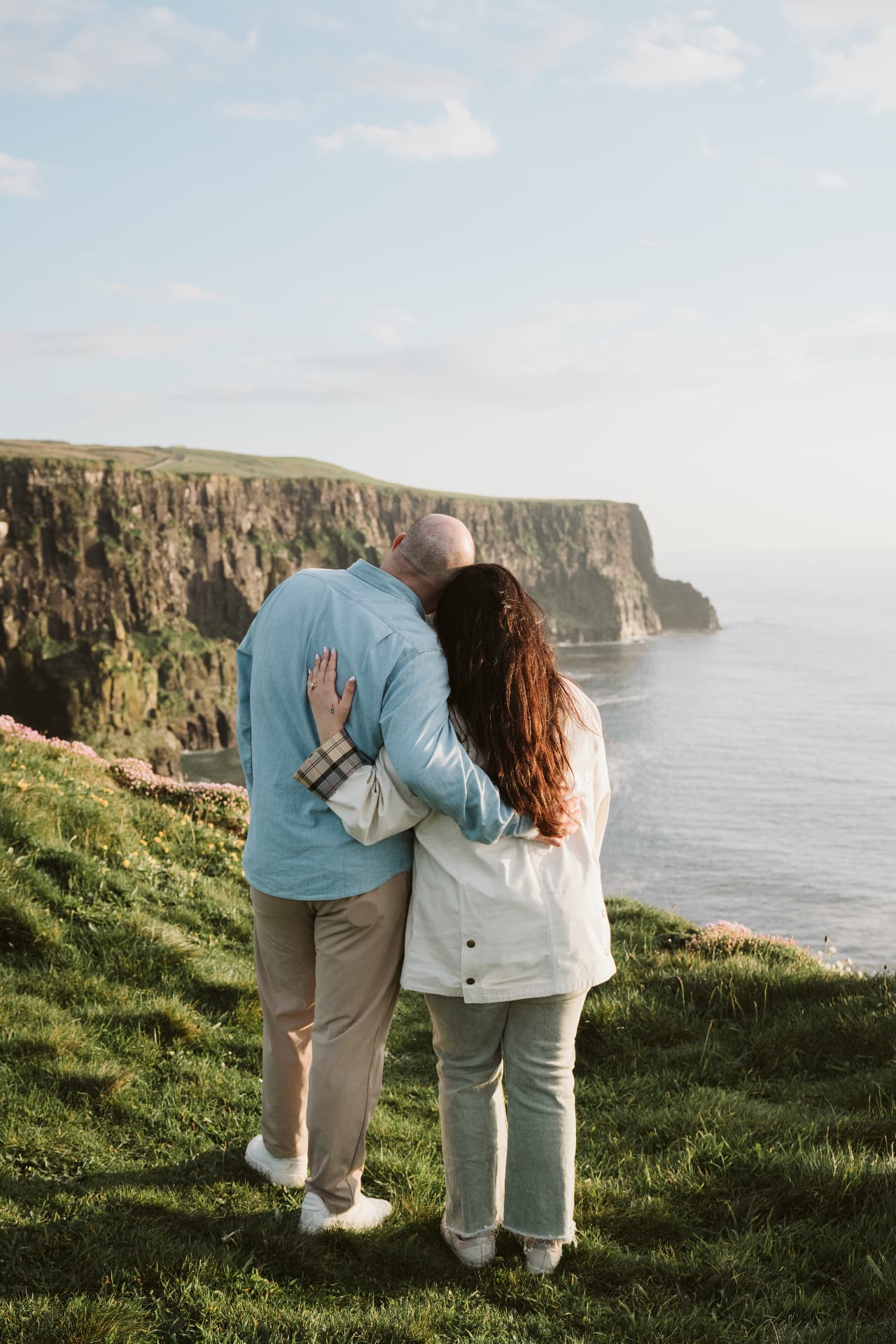 Jaime and Nolan looking out over the Cliffs of Moher and the Atlantic Ocean